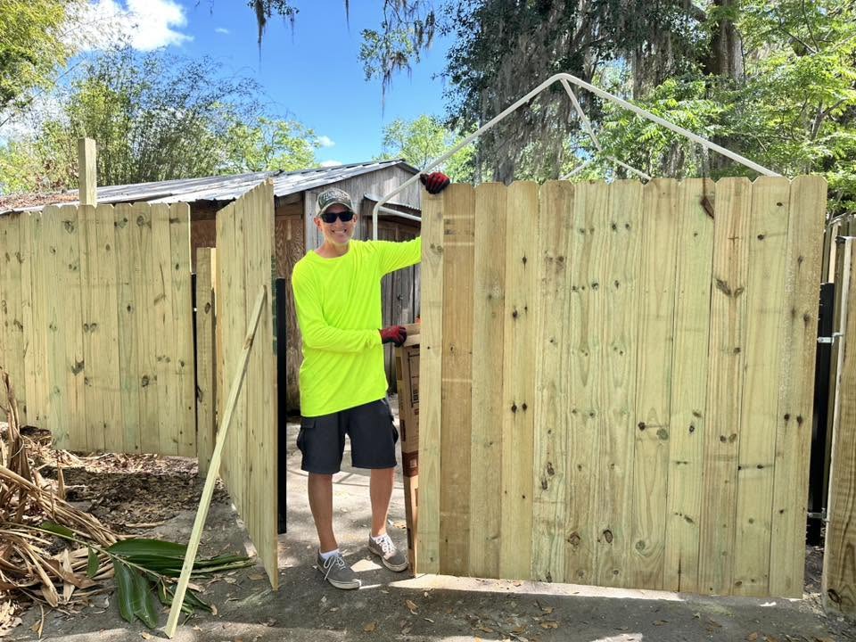 Pinnacle Fencing employee Ben working on a fence